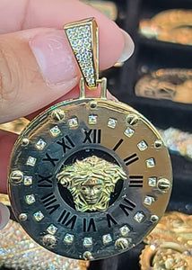 Yellow Gold Roman Numeral Clock with Medusa Face