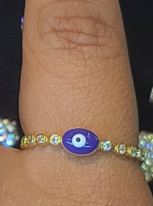Yellow Gold Circular Ring With Purple Ojito